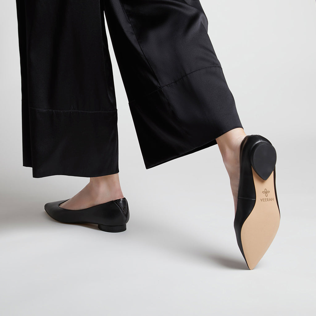 Black vegan leather pointed-toe ballet flats with a tear drop shaped low heel