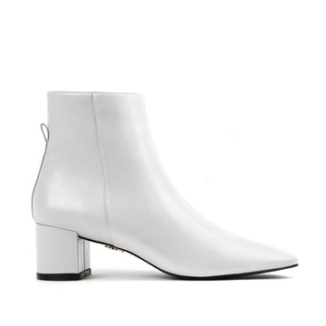 White vegan leather ankle boot with block heel – sleek and modern women's vegan footwear for versatile styling and all-day comfort.