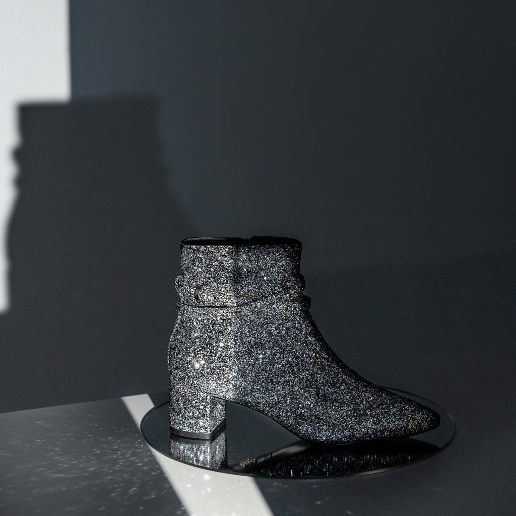 Silver glitter vegan ankle boot with block heel – stylish and eye-catching women's footwear for parties and special occasions.