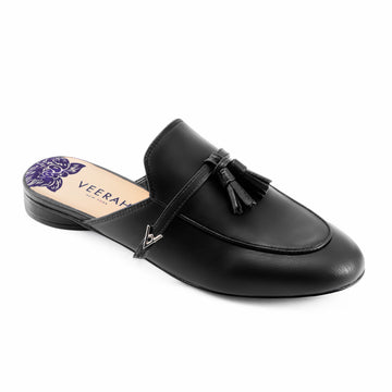 Black vegan apple leather loafer style slip-on mules by Veerah with a minimalist design and floral insole detail