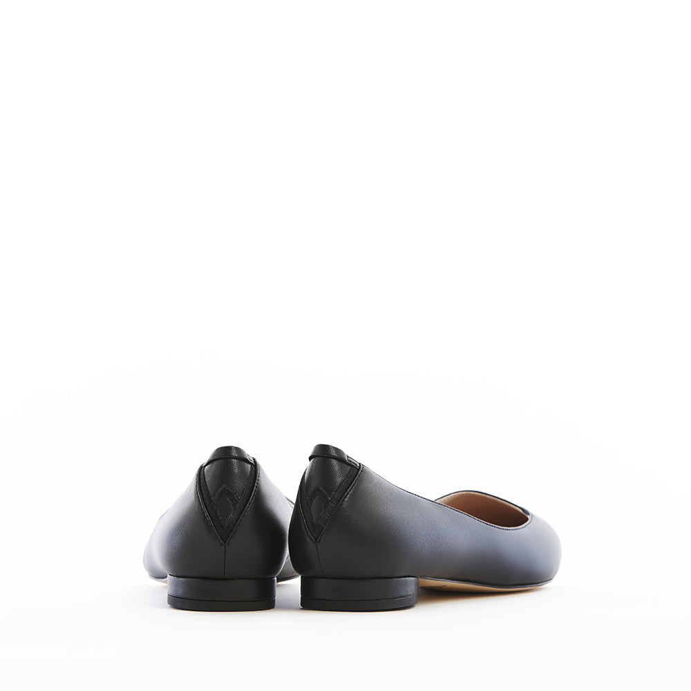 Black vegan leather pointed-toe ballet flats with a low heel