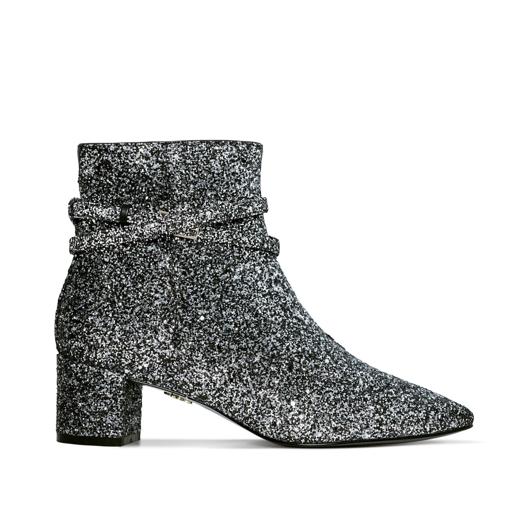 Silver glitter vegan ankle boot with block heel and buckle straps – stylish and eye-catching women's footwear for parties and special occasions.