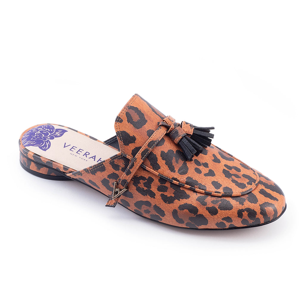 Leopard print apple leather slip-on mules by Veerah with a minimalist design and floral insole detail