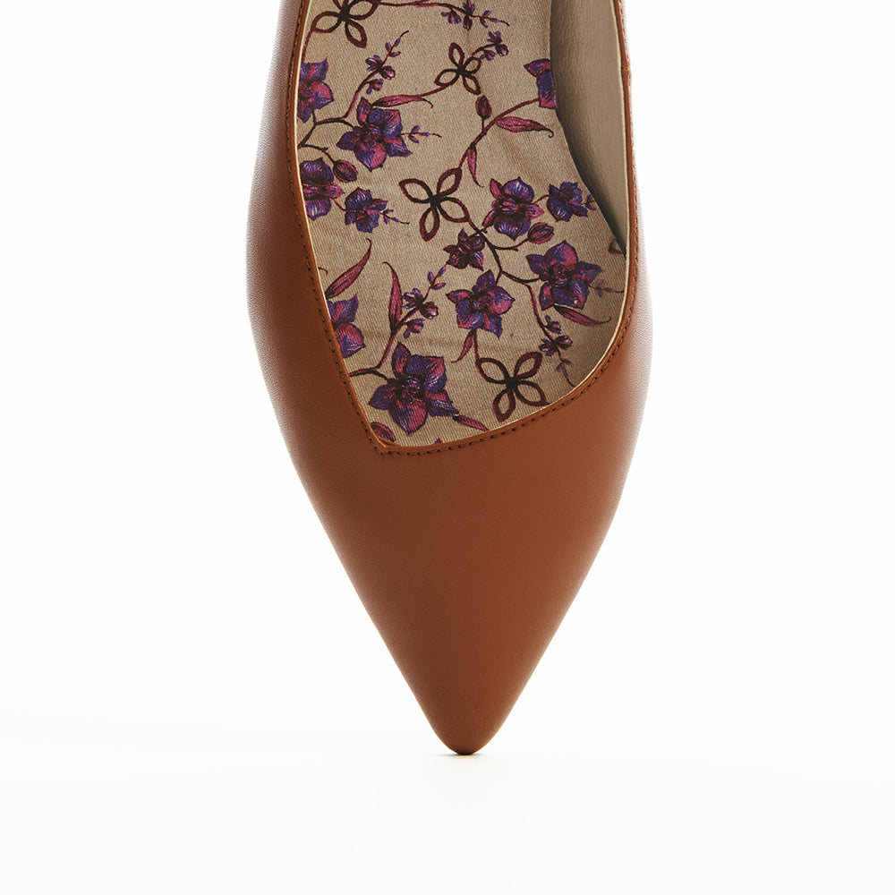 Cognac brown vegan leather pointed-toe ballet flats with a low heel and asymmetric v-vamp for a flattering fit  