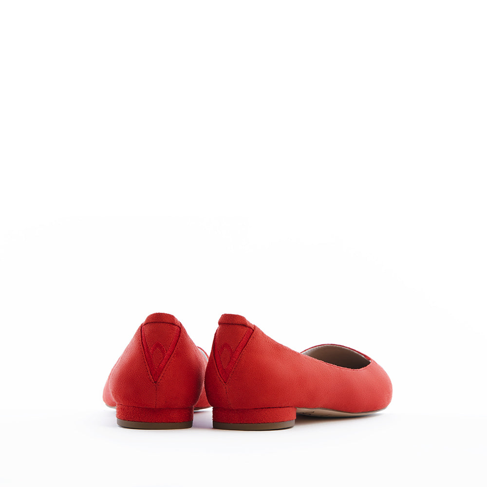 Red vegan faux suede pointed-toe ballet flats with a low heel